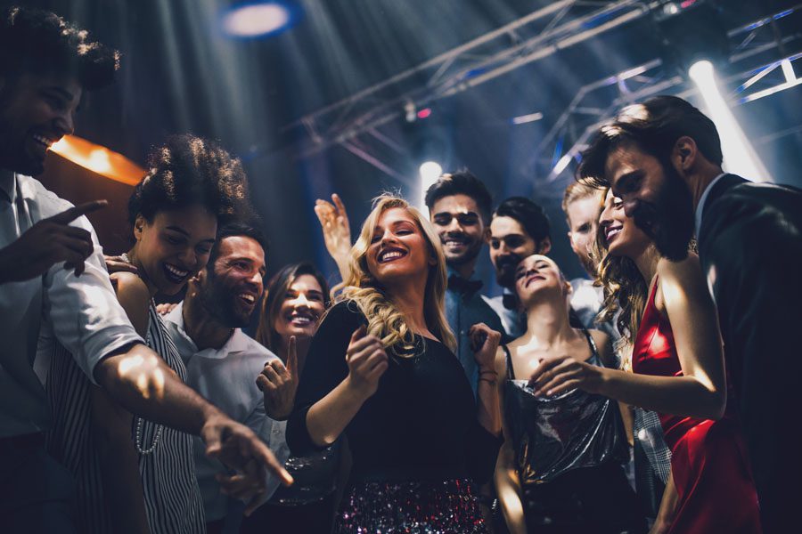Nightclub and Bar Insurance - Friends Dancing at a Club and Having Fun